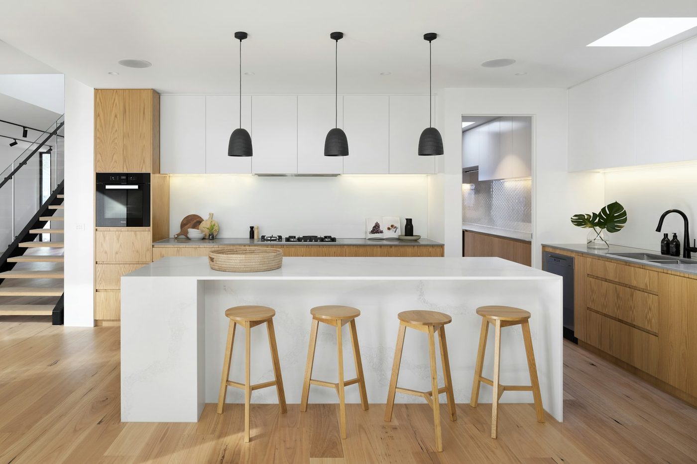 Natural oak built-in cabinetry with island